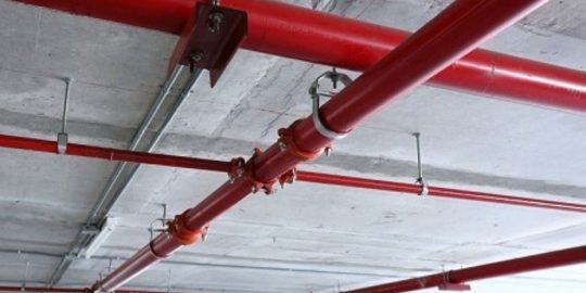 What is the purpose of a fire safety design report at building consent stage?